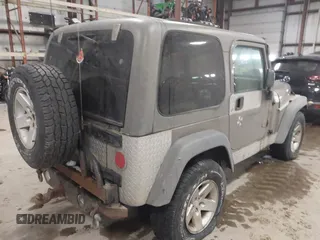 2005 Jeep Wrangler Rubicon with VIN 1J4FA69S65P311732, listed as a IAAI auction lot 41442147 with 174,277 mi miles. Bid and sale history available at carsss.com. Image 4.
