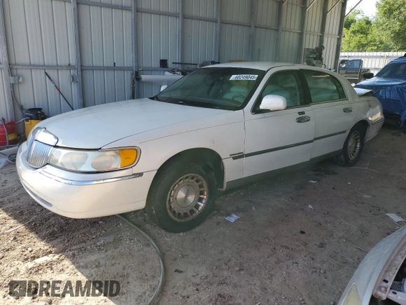 1999 Lincoln Town Car Executive with VIN 1LNHM81W2XY658371, listed as a Copart auction lot 60249045 with 191,266 mi miles and Salvage title. Bid and sale history available at DreamBid. Image 1.
