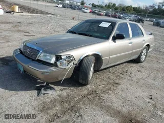 2004 Mercury Grand Marquis LS Premium with VIN 2MEFM75W14X606756, listed as a IAAI auction lot 41572470 with 106,498 mi miles. Bid and sale history available at carsss.com. Image 2.