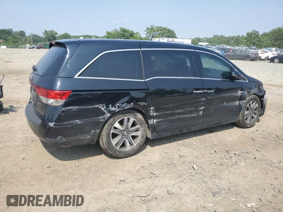 2014 Honda Odyssey Touring with VIN 5FNRL5H91EB015162, listed as a Copart auction lot 60643135 with 176,898 mi miles and Salvage title. Bid and sale history available at DreamBid. Image 3.