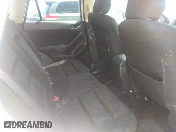 2014 Mazda CX-5 Touring with VIN JM3KE2CY7E0364311, listed as a IAAI auction lot 42108176 with 90,506 mi miles and . Bid and sale history available at DreamBid. Image 8.