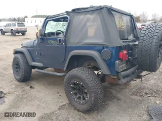 2003 Jeep Wrangler X with VIN 1J4FA39S23P300447, listed as a IAAI auction lot 41791733 with 165,576 mi miles. Bid and sale history available at carsss.com. Image 3.