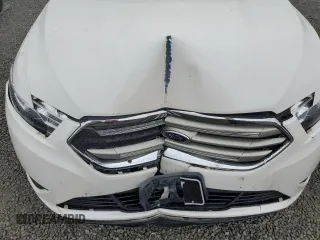 2016 Ford Taurus SEL z VIN 1FAHP2E87GG146931, wystawiony jako Copart lot #56135655 z przebiegiem 99 733 mil mil oraz Szkoda całkowita • Salvage title. Historia ofert i sprzedaży dostępna na DreamBid. Obrazek 11.