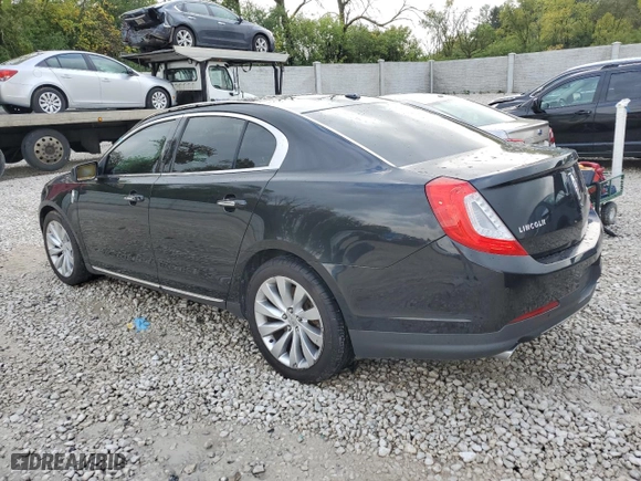 2013 Lincoln MKS with VIN 1LNHL9EK3DG618057, listed as a Copart auction lot 69394293 with 195902 miles and Salvage Title. Bid and sale history available at carsss.com. Image 2.
