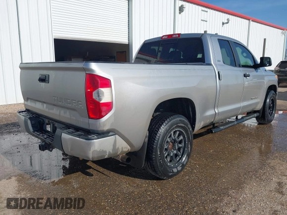 2014 Toyota Tundra SR with VIN 5TFRM5F13EX078411, listed as a IAAI auction lot 42702477 with 123,336 mi miles and . Bid and sale history available at DreamBid. Image 4.