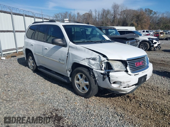 2006 GMC Envoy SLT with VIN 1GKDS13S062128531, listed as a IAAI auction lot 41458983 with 119,385 mi miles. Bid and sale history available at carsss.com. Image 1.