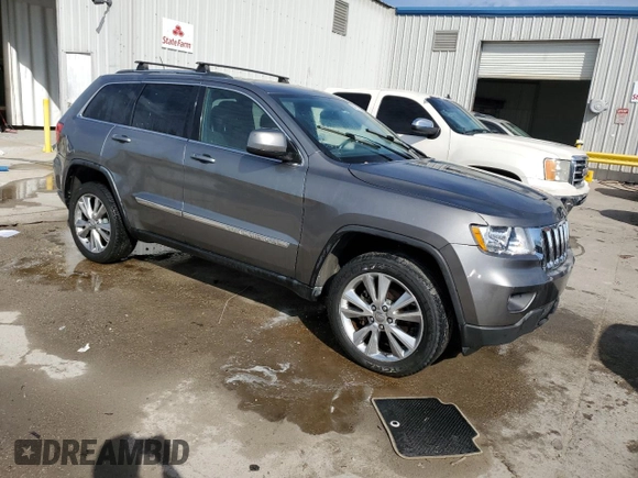2012 Jeep Grand Cherokee Laredo with VIN 1C4RJEAG1CC306950, listed as a Copart auction lot 84912434 with 128,659 mi miles and Salvage Title. Bid and sale history available at carsss.com. Image 4.