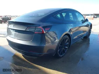 2018 Tesla Model 3 Long Range Battery with VIN 5YJ3E1EA8JF010834, listed as a IAAI auction lot 41598099 with 83,252 mi miles. Bid and sale history available at carsss.com. Image 4.