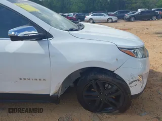 2019 Chevrolet Equinox Premier z VIN 2GNAXPEX9K6177386, wystawiony jako IAAI lot #42172103 z przebiegiem 61 045 mil mil oraz . Historia ofert i sprzedaży dostępna na DreamBid. Obrazek 17.