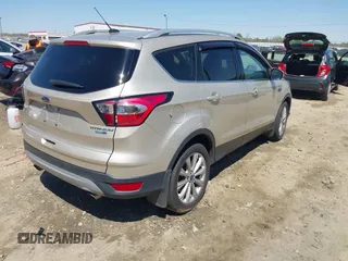 2017 Ford Escape Titanium with VIN 1FMCU9JD3HUC90273, listed as a IAAI auction lot 41828236 with 71,351 mi miles. Bid and sale history available at carsss.com. Image 4.