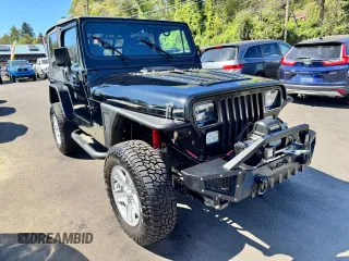 1992 Jeep Wrangler with VIN 2J4FY19P2NJ525592, listed as a Copart auction lot 63951475 with 156,627 mi miles and Clean title. Bid and sale history available at DreamBid. Image 1.