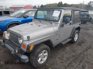 2002 Jeep Wrangler Sport with VIN 1J4FA49SX2P706691, listed as a IAAI auction lot 41965852 with 179,553 mi miles. Bid and sale history available at carsss.com. Image 2.