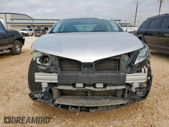 2014 Lincoln MKZ z VIN 3LN6L2G90ER815819, wystawiony jako Copart lot #61189515 z przebiegiem 101 148 mil mil oraz Szkoda całkowita • Salvage title. Historia ofert i sprzedaży dostępna na DreamBid. Obrazek 5.
