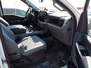 2023 Ford F-150 Lightning Pro with VIN 1FTVW1EL2PWG18764, listed as a IAAI auction lot 41908278 with 16,276 mi miles and . Bid and sale history available at DreamBid. Image 5.