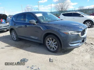 2020 Mazda CX-5 Grand Touring with VIN JM3KFBDM2L0768770, listed as a IAAI auction lot 41695058 with 44,192 mi miles. Bid and sale history available at carsss.com. Image 1.
