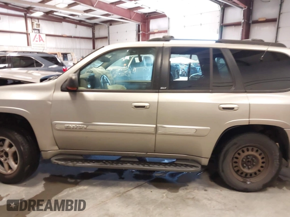 2003 GMC Envoy SLT z VIN 1GKDS13S932299354, wystawiony jako IAAI lot #41238557 z przebiegiem 251 535 mil mil oraz . Historia ofert i sprzedaży dostępna na DreamBid. Obrazek 15.
