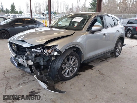 2020 Mazda CX-5 Grand Touring with VIN JM3KFADM0L0738693, listed as a IAAI auction lot 41725906 with 63,629 mi miles. Bid and sale history available at carsss.com. Image 2.