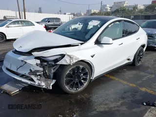 2023 Tesla Model Y Long Range with VIN 7SAYGDEE3PF900030, listed as a IAAI auction lot 41147192 with 13,903 mi miles and . Bid and sale history available at DreamBid. Image 18.