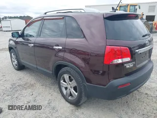 2013 Kia Sorento EX with VIN 5XYKU4A21DG312753, listed as a IAAI auction lot 41033124 with 197,459 mi miles and . Bid and sale history available at carsss.com. Image 3.