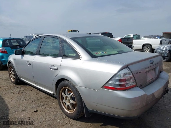 2009 Ford Taurus SE with VIN 1FAHP23W69G118350, listed as a IAAI auction lot 41806537 with 243428 miles. Bid and sale history available at carsss.com. Image 3.