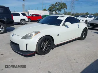 2004 Nissan 350Z Touring with VIN JN1AZ34E74T064156, listed as a IAAI auction lot 41498213 with 148,370 mi miles. Bid and sale history available at carsss.com. Image 17.