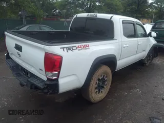 2017 Toyota Tacoma SR5 with VIN 3TMCZ5AN0HM099549, listed as a IAAI auction lot 33153884 with 58,517 mi miles and . Bid and sale history available at DreamBid. Image 3.