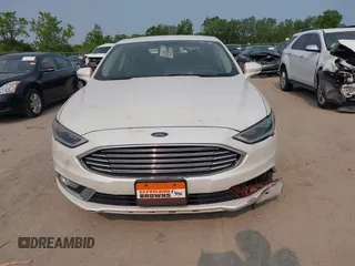 2017 Ford Fusion Titanium z VIN 3FA6P0K92HR396113, wystawiony jako IAAI lot #42402969 z przebiegiem 185 620 mil mil oraz . Historia ofert i sprzedaży dostępna na DreamBid. Obrazek 12.