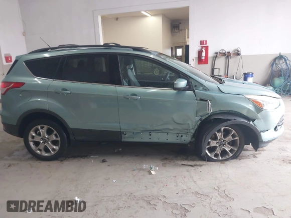 2013 Ford Escape SE with VIN 1FMCU0GX6DUC09872, listed as a IAAI auction lot 42020093 with 215,906 mi miles and . Bid and sale history available at DreamBid. Image 14.