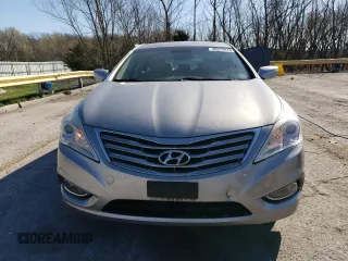 2013 Hyundai Azera с VIN KMHFG4JG8DA256908, выставлен на аукционе Copart как лот 50573915 с пробегом 146 015 миль миль и Списание • Salvage title. История ставок и продаж доступна на DreamBid. Изображение 5.