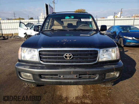 1999 Toyota Land Cruiser with VIN JT3HT05J5X0072564, listed as a Copart auction lot 77000044 with 312,428 mi miles and Salvage Title. Bid and sale history available at carsss.com. Image 5.