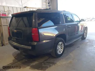 2015 Chevrolet Suburban LT with VIN 1GNSKJKC5FR264018, listed as a IAAI auction lot 42056645 with 194,479 mi miles. Bid and sale history available at carsss.com. Image 4.