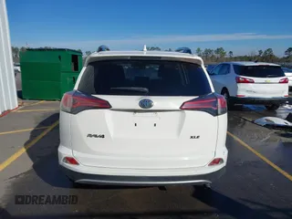 2018 Toyota RAV4 XLE with VIN JTMWFREV7JJ743297, listed as a IAAI auction lot 41579019 with 102,442 mi miles. Bid and sale history available at carsss.com. Image 16.