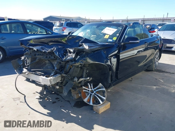 2015 BMW 2 Series 228i with VIN WBA1K5C57FV473826, listed as a IAAI auction lot 41866820 with 130,823 mi miles. Bid and sale history available at carsss.com. Image 2.