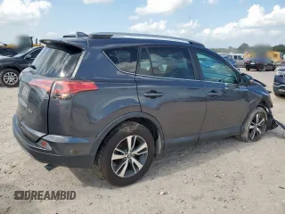 2018 Toyota RAV4 XLE with VIN 2T3WFREV2JW409292, listed as a Copart auction lot 61577355 with 189,258 mi miles and Salvage title. Bid and sale history available at DreamBid. Image 3.