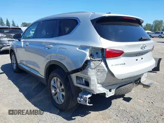 2019 Hyundai Santa Fe SE with VIN 5NMS2CAD9KH122140, listed as a IAAI auction lot 42616171 with 50,794 mi miles and . Bid and sale history available at DreamBid. Image 3.