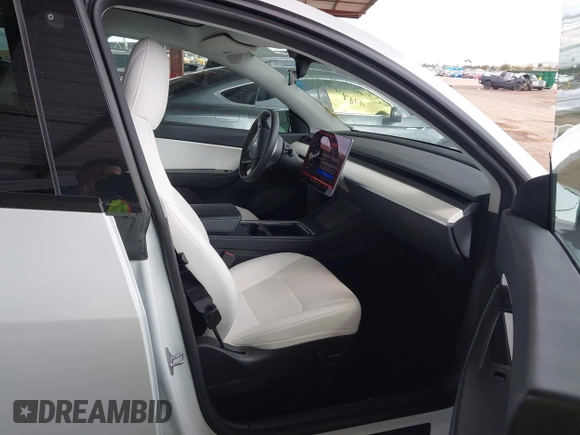 2022 Tesla Model Y Performance with VIN 7SAYGDEF4NF449986, listed as a IAAI auction lot 41754916 with 64,384 mi miles and . Bid and sale history available at DreamBid. Image 5.