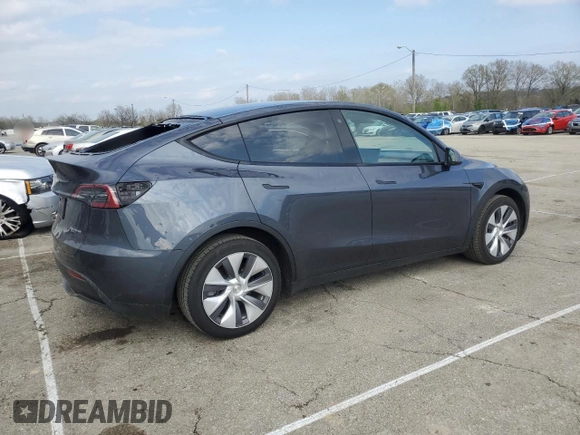 2023 Tesla Model Y Long Range with VIN 7SAYGDEE2PA024693, listed as a Copart auction lot 52595935 with 35,179 mi miles and Salvage Title. Bid and sale history available at DreamBid. Image 3.