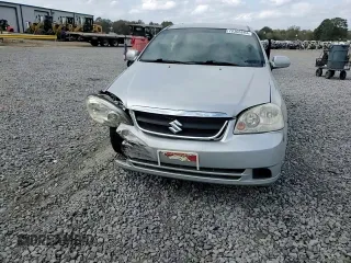 2006 Suzuki Forenza z VIN KL5JD56Z96K362651, wystawiony jako Copart lot #78306894 z przebiegiem 167 916 mil mil oraz Tytuł czysty. Historia ofert i sprzedaży dostępna na DreamBid. Obrazek 11.