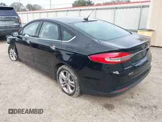 2018 Ford Fusion SE z VIN 3FA6P0H79JR276224, wystawiony jako IAAI lot #41277958 z przebiegiem 99 098 mil mil oraz . Historia ofert i sprzedaży dostępna na DreamBid. Obrazek 3.