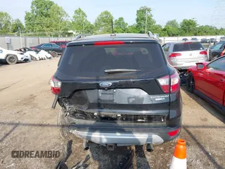 2018 Ford Escape Titanium with VIN 1FMCU9J95JUB30803, listed as a IAAI auction lot 42286536 with 63,309 mi miles and . Bid and sale history available at DreamBid. Image 17.