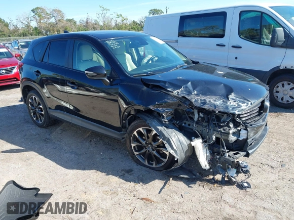 2016 Mazda CX-5 Grand Touring with VIN JM3KE4DY4G0677605, listed as a IAAI auction lot 41642893 with Not Provided miles and . Bid and sale history available at carsss.com. Image 1.