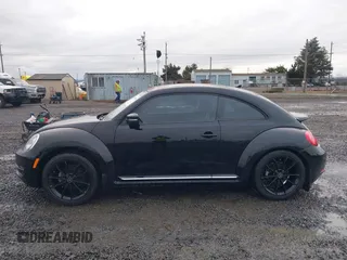 2014 Volkswagen Beetle 2.5L w/Sun with VIN 3VWJP7AT3EM608906, listed as a IAAI auction lot 41501830 with 42,804 mi miles and . Bid and sale history available at DreamBid. Image 14.