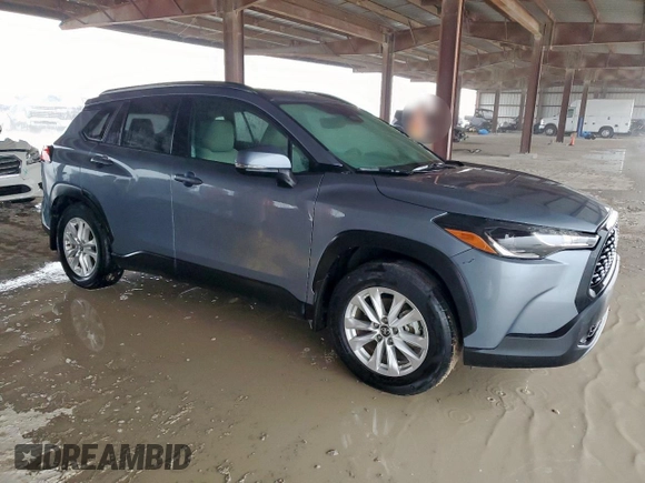2023 Toyota Corolla Cross LE with VIN 7MUBAAAG4PV042580, listed as a Copart auction lot 63797305 with 59,576 mi miles and Salvage title. Bid and sale history available at DreamBid. Image 4.