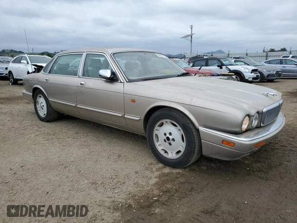 1997 Jaguar XJ Vanden Plas with VIN SAJKX6245VC800386, listed as a Copart auction lot 53651675 with 158,185 mi miles and Salvage Title. Bid and sale history available at DreamBid. Image 4.