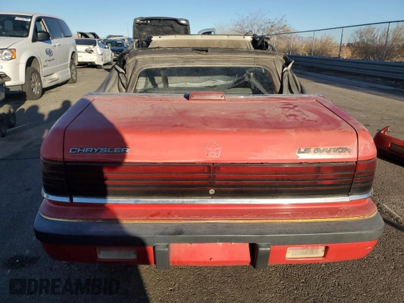 1989 Chrysler LeBaron z VIN 1C3XJ45K0KG251502, wystawiony jako Copart lot #87112404 z przebiegiem 166 445 mil mil oraz Tytuł czysty. Historia ofert i sprzedaży dostępna na DreamBid. Obrazek 6.