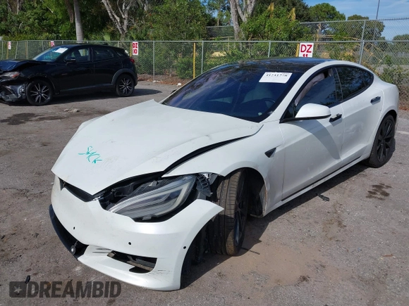 2020 Tesla Model S Long Range with VIN 5YJSA1E2XLF360260, listed as a IAAI auction lot 41241778 with 141,594 mi miles. Bid and sale history available at carsss.com. Image 17.