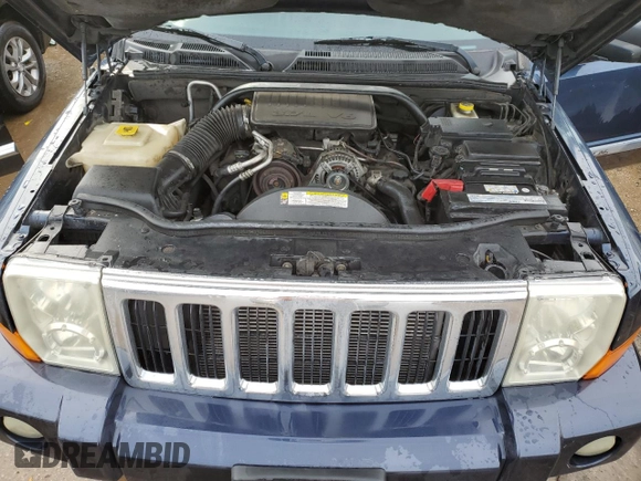 2010 Jeep Commander Sport with VIN 1J4RG4GK5AC119433, listed as a Copart auction lot 87657265 with 212,973 mi miles and Salvage title. Bid and sale history available at DreamBid. Image 12.