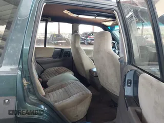 1994 Jeep Grand Cherokee Laredo with VIN 1J4GZ58S4RC280650, listed as a IAAI auction lot 42041261 with 199,265 mi miles and . Bid and sale history available at DreamBid. Image 8.
