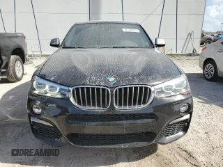 2017 BMW X4 M40i with VIN 5UXXW7C51H0U25766, listed as a Copart auction lot 77749324 with 101,289 mi miles and Salvage Title. Bid and sale history available at carsss.com. Image 5.
