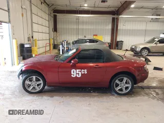 2007 Mazda MX-5 Miata Sport z VIN JM1NC25F970132299, wystawiony jako IAAI lot #41622791 z przebiegiem 72 392 mil mil oraz . Historia ofert i sprzedaży dostępna na DreamBid. Obrazek 15.